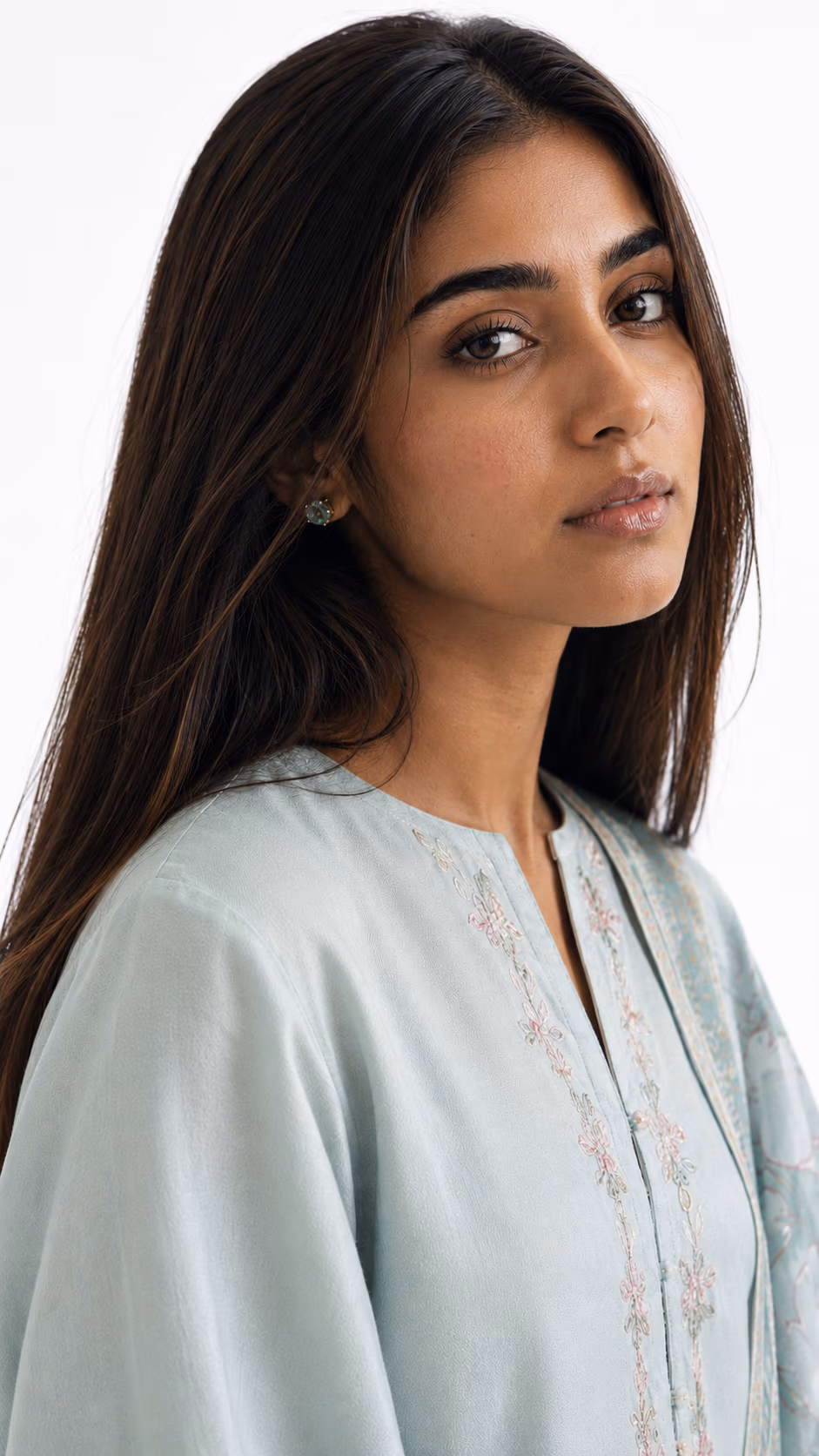 AI fashion model wearing a pale blue embroidered garment