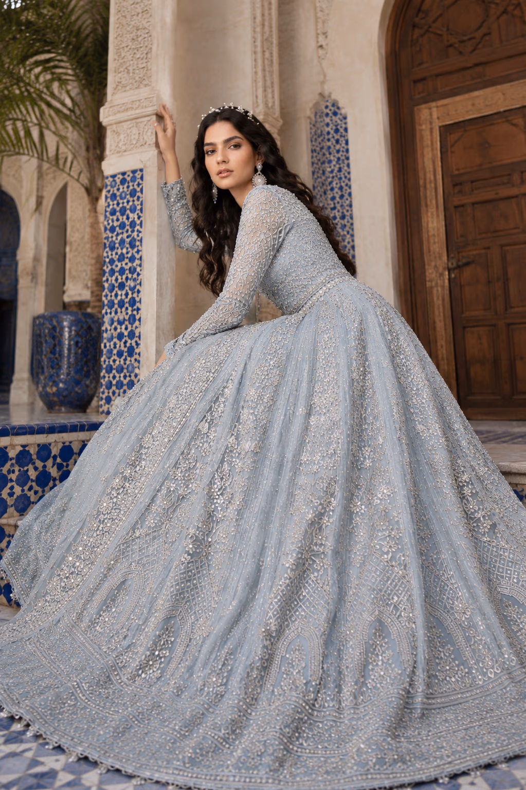 Fashion model in an expressive leaning pose